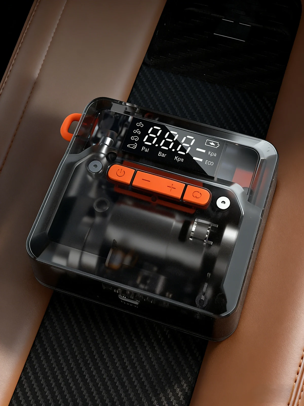 Compact Q5 tyre inflator resting on a car seat